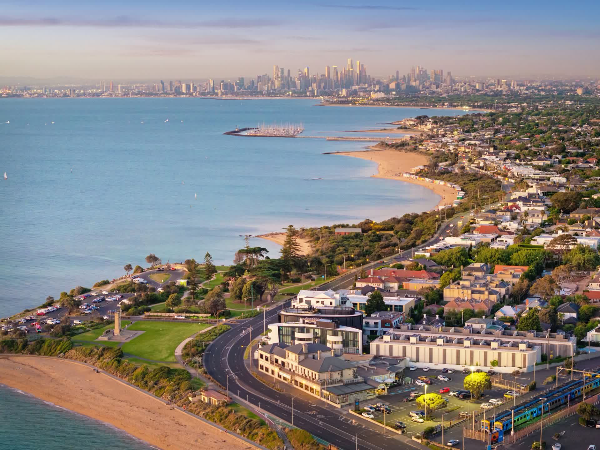 Aerial towards the Melbourne skyline across the bay